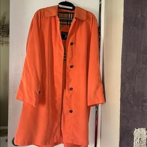 Burberry Coral Lined Trench with Classic Check.  The coat runs large.  It’s M.